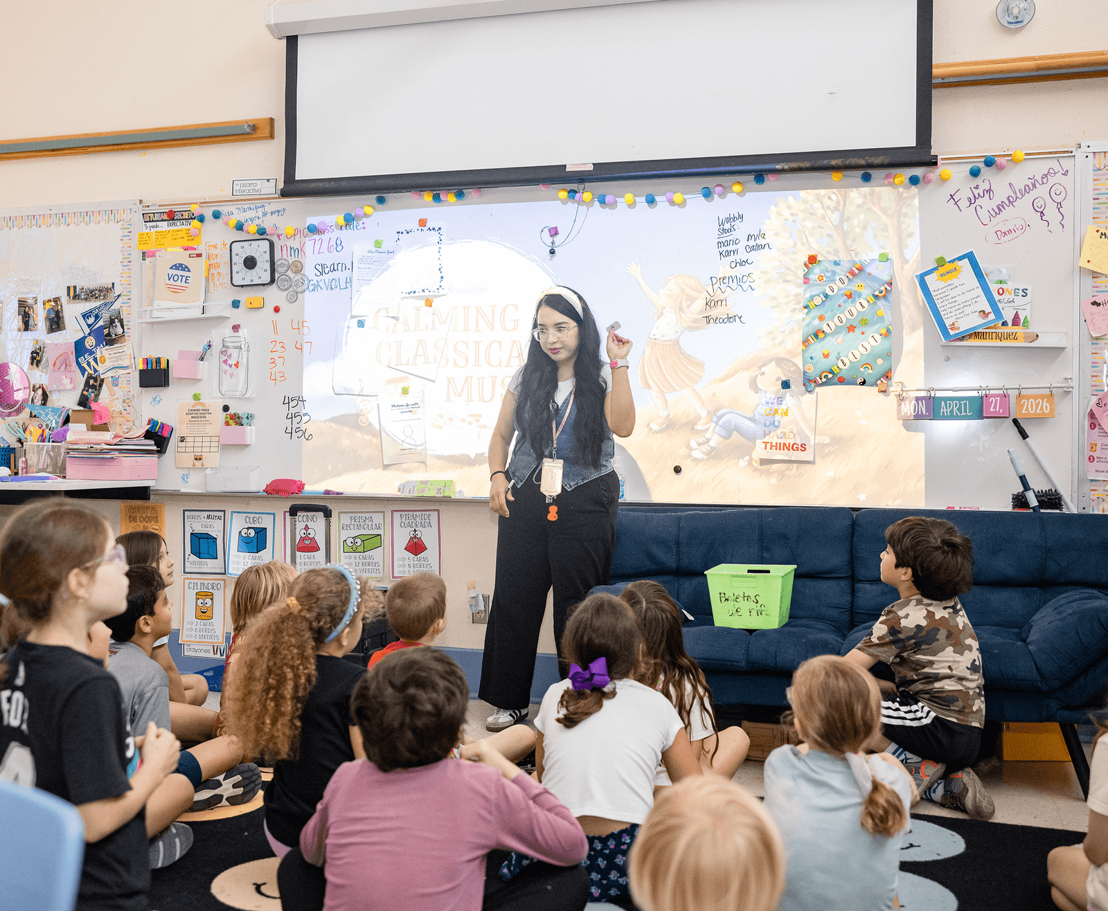 An Alamo Heights teacher working with students in her classroom
